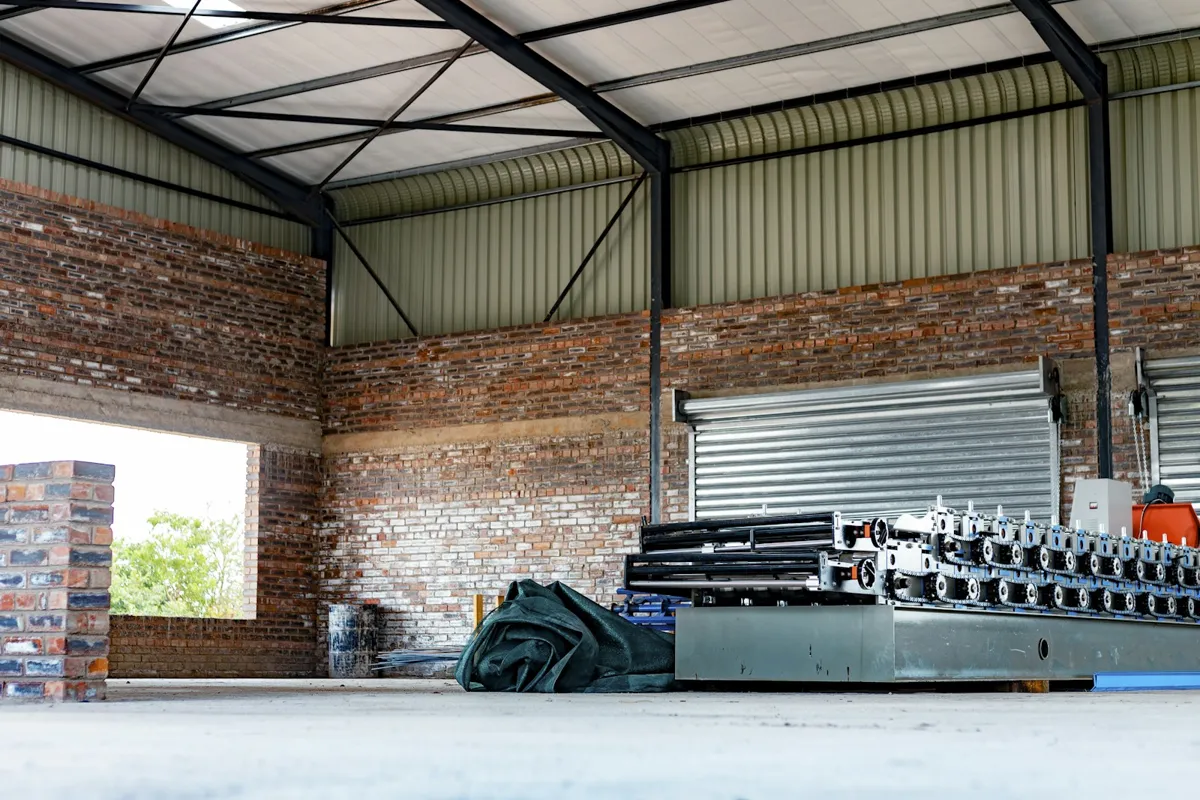 Warehouse interior with a roll-up door in the back wall