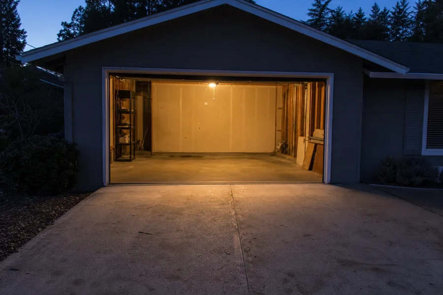 Mid-century rambler with an older wood garage door