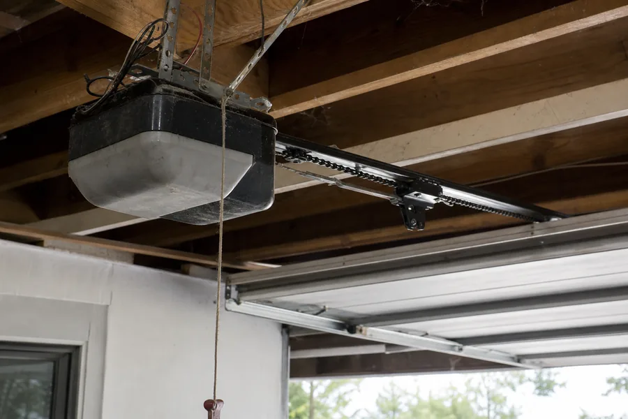 A garage door opener motor and rail in a Renton, WA garage